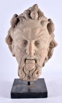 A SOUTHERN EUROPEAN CARVED STONE HEAD OF A BEARDED MALE possibly Early Roman or Greek. Head 28 cm