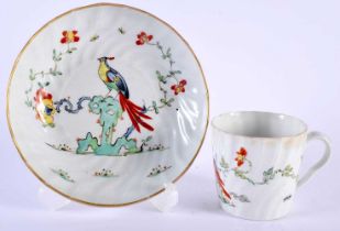 AN 18TH CENTURY WORCESTER FLUTED CUP AND SAUCER painted with the Sir Joshua Reynolds pattern. 12