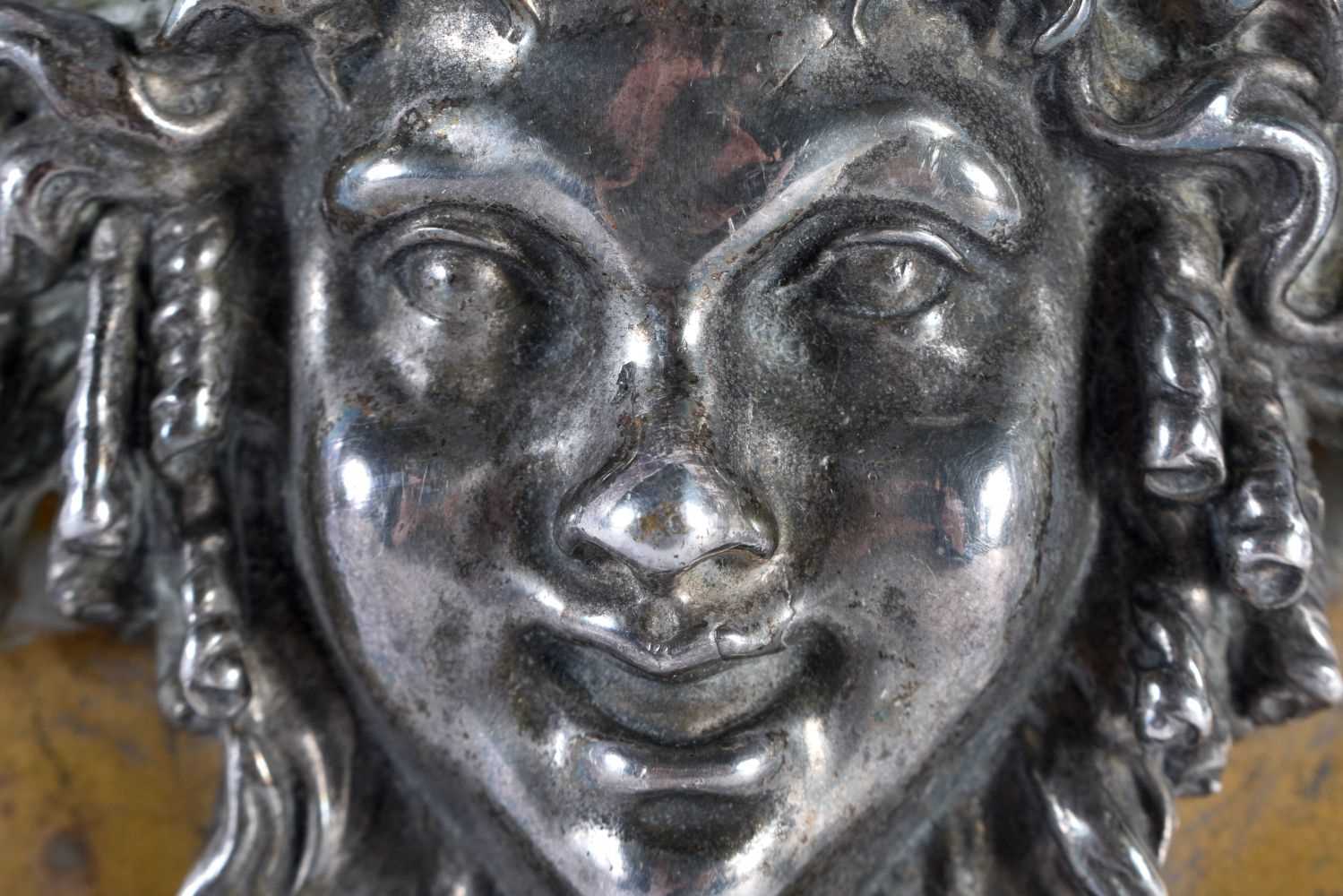 A 19TH CENTURY FRENCH GRAND TOUR SILVERED BRONZE WALL PLAQUE depicting a Romanesque mask head. 18 cm - Image 2 of 3