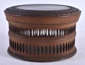 AN ANTIQUE ANGLO INDIAN CARVED WOOD CRICKET BOX AND COVER. 10.5 cm diameter.