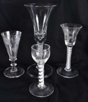 FOUR ANIQUE WINE GLASSES three with spiral twists. Largest 22.5 cm high. (4)