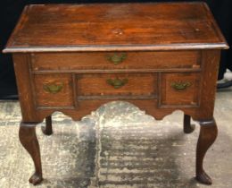 A GEORGE II OAK CROSSBANDED SIDE TABLE C1740 with four drawers. 83 cm x 70 cm x 46 cm.