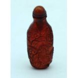 An Amber Glass Snuff Bottle. 7.9cm x 3.1cm x 2.1cm. Weight 35.24g