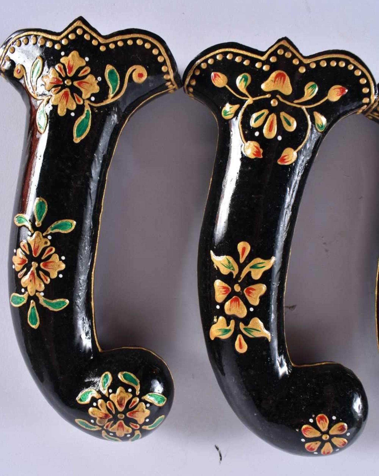 A SET OF FIVE MIDDLE EASTERN QAJAR LACQUER HARDSTONE DAGGER HANDLES overlaid with foliage and vines. - Image 4 of 6