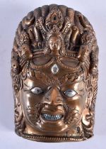 AN 18TH/19TH CENTURY SINO TIBETAN SILVER INLAID BRONZE MASK formed as a scowling male deity. 14 cm x