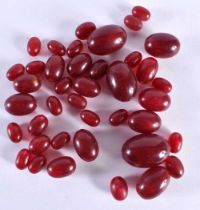 A COLLECTION CHERRY AMBER TYPE BEADS. (qty)