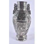 A FINE AND RARE 19TH CENTURY CHINESE EXPORT TWIN HANDLED SILVER VASE decorated in relief with