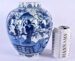 AN 18TH CENTURY DUTCH DELFT RIBBED BLUE AND WHITE POTTERY VASE painted with Oriental figures