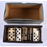 A CASED SET OF ANTIQUE BONE DOMINOS. (qty)