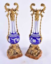 A FINE PAIR OF 19TH CENTURY BOHEMIAN TWIN HANDLED GLASS VASES with lovely quality gilded berry and