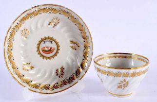 A RARE 18TH CENTURY WORCESTER FLUTED TEABOWL AND SAUCER painted with an internal view of two