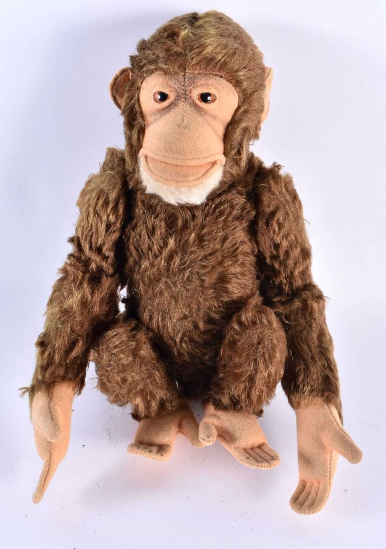 A MID CENTURY POSSIBLE STEIFF MONKEY WITH SQUEAKER. 25 cm high.