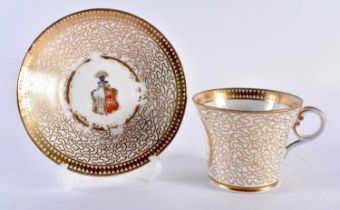 A LATE 18TH/19TH CENTURY WORCESTER ARMORIAL PORCELAIN CUP AND SAUCER painted with seaweed motifs. 13