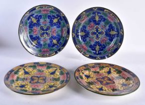FOUR LARGE UNUSUAL ROYAL DOULTON ARTS AND CRAFTS STYLE PLATES. 26 cm diameter. (4)