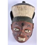 A TRIBAL CARVED WOOD POLYCHROMED MASK. 32 cm x 24 cm.