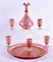 A 19TH CENTURY BOHEMIAN RUBY GILDED GLASS LIQUOR DECANTER with tray and glasses. Largest 19 cm