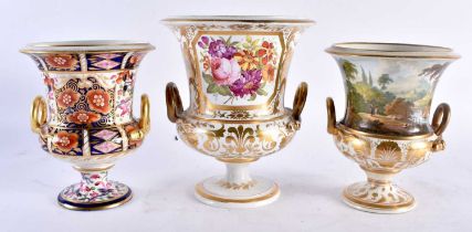 THREE EARLY 19TH CENTURY DERBY TWIN HANDLED PORCELAIN VASES painted with various subjects. Largest