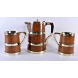 A LOVELY LATE VICTORIAN SILVER PLATED COOPERED OAK ALE JUG with two matching tankards. Largest 24 cm