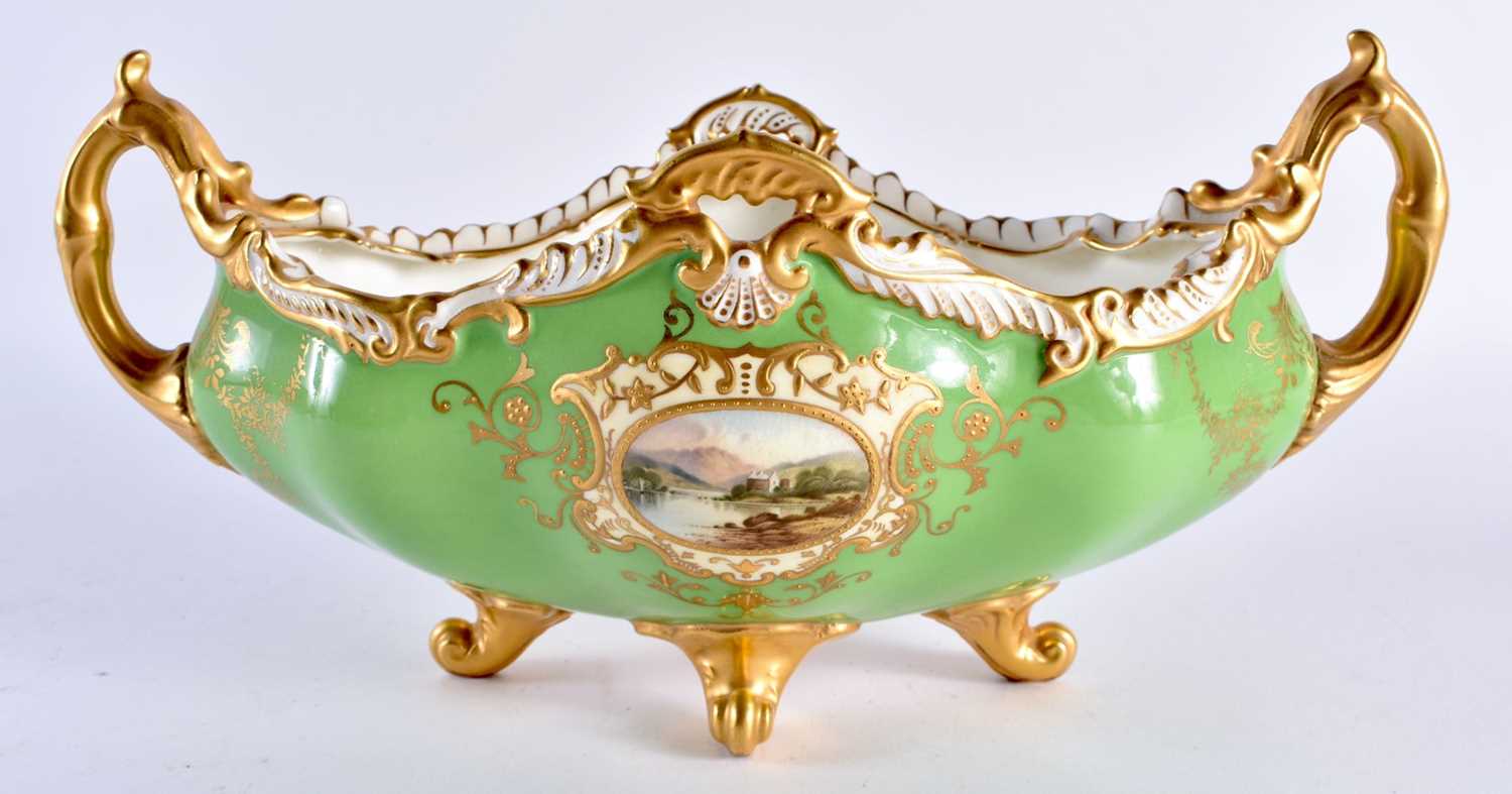 Late 19th early 20th century Coalport two handled boat shaped vase decorated with two gilt panels