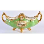 Late 19th early 20th century Coalport two handled boat shaped vase decorated with two gilt panels