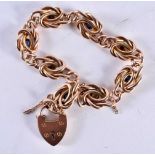 A 9 Carat Gold Link Bracelet with Heart Lock by Henry Allday & Son. Hallmarked Birmingham 2003. 20cm