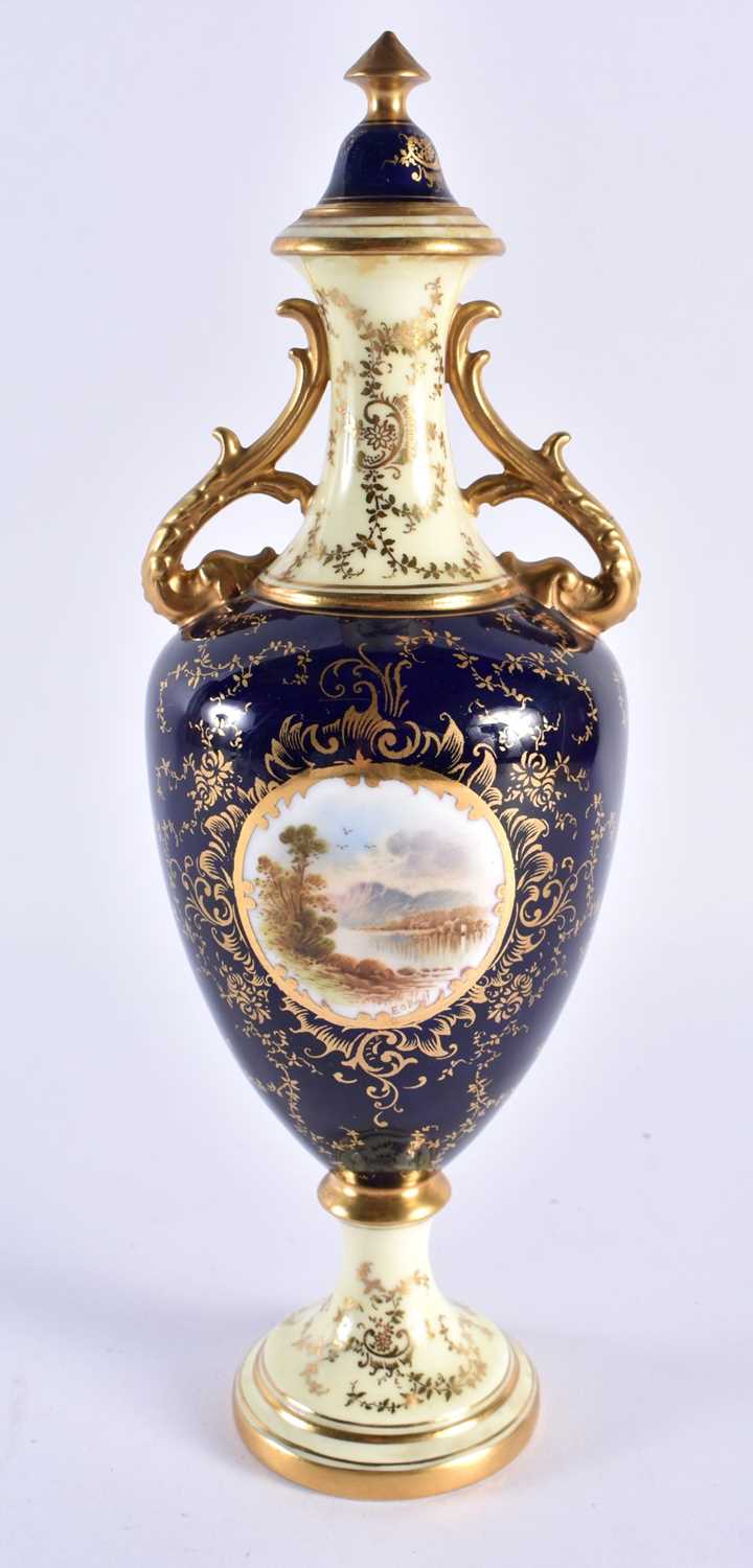 Late 19th early 20th century Coalport vase and cover painted with a scene of Loch Doon on a cobalt