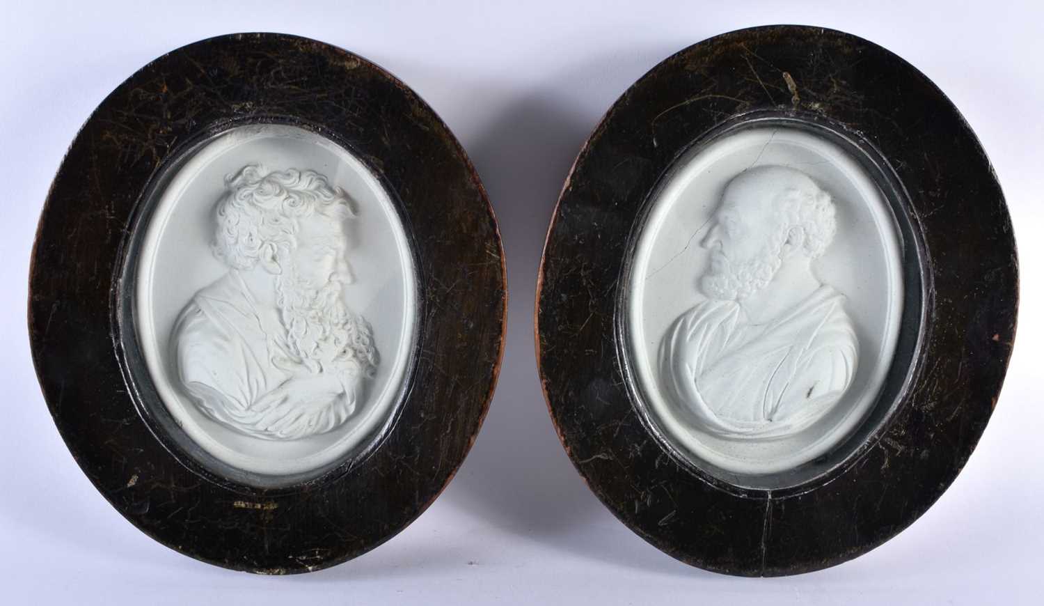 A PAIR OF 19TH CENTURY EUROPEAN GRAND TOUR PLASTER PLAQUES within ebonised frames. 23 cm x 18 cm.
