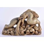 A 19TH CENTURY CHINESE CARVED SOAPSTONE FIGURE OF A DRAGON Qing. 14 cm x 9 cm.