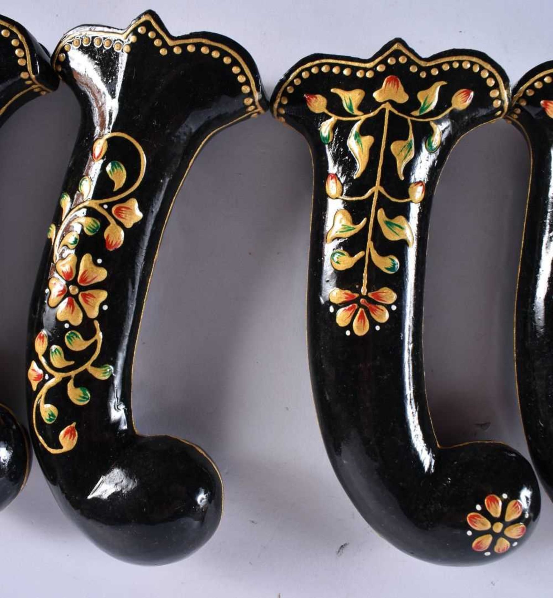 A SET OF FIVE MIDDLE EASTERN QAJAR LACQUER HARDSTONE DAGGER HANDLES overlaid with foliage and vines. - Image 3 of 6