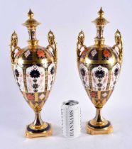 A LOVELY LARGE PAIR OF ROYAL CROWN DERBY IMARI TWIN HANDLED PORCELAIN VASES. 42 cm x 14 cm.