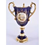 Late 19th early 20th century Coalport three handled loving cup painted with a Loch scene on a cobalt