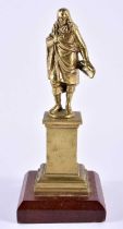 A 19TH CENTURY EUROPEAN GRAND TOUR BRONZE FIGURE OF A MALE modelled upon a wooden base. 18 cm high.