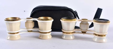 Two Pairs of Russian Opera Glasses (1 cased). 9.5cm wide