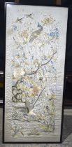 A large framed 19th Century Chinese silk embroidery depicting birds in foliage 140 x 60 cm