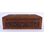 A 19TH CENTURY INDIAN CARVED SANDALWOOD TAJ MAHAL CASKET decorated with foliage and vines. 24 cm x