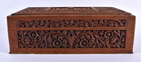 A 19TH CENTURY INDIAN CARVED SANDALWOOD TAJ MAHAL CASKET decorated with foliage and vines. 24 cm x