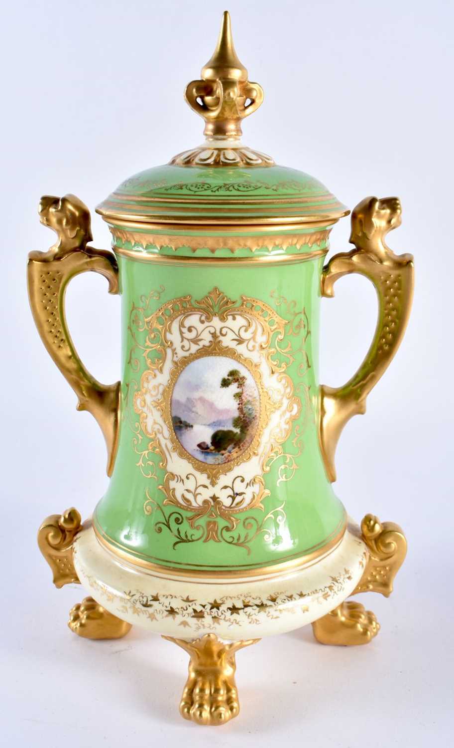 Late 19th early 20th century Coalport green ground vase and cover with lion handles. 25cm high