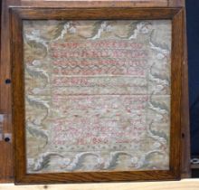 A framed sampler dated 1850 38 x 37 cm