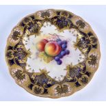 Royal Worcester plate with a raised blue and gilt border, the centre painted with fruit by Albert