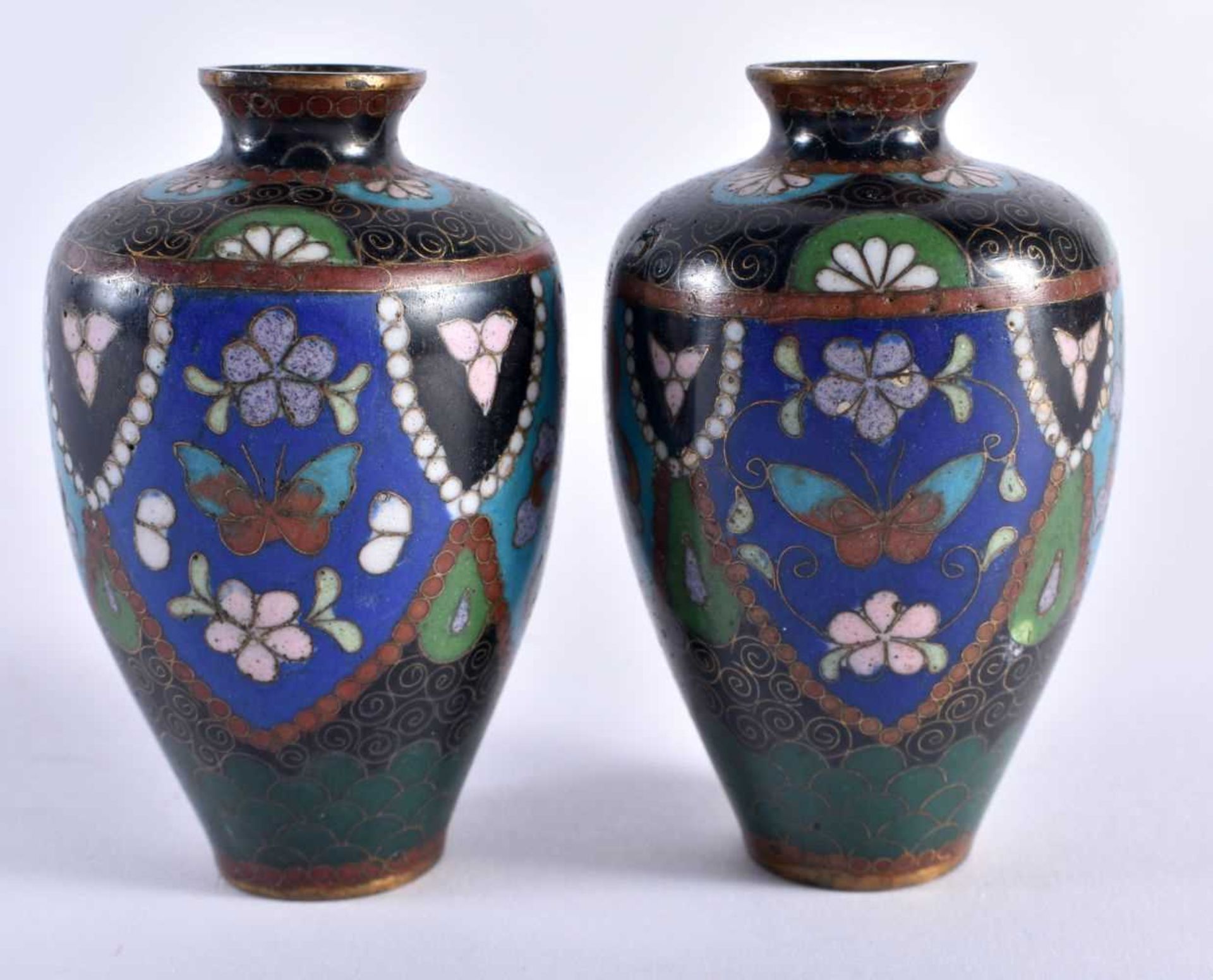 A MINIATURE PAIR OF LATE 19TH CENTURY JAPANESE MEIJI PERIOD CLOISONNE ENAMEL VASES decorated with