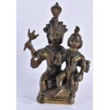 A 19TH CENTURY INDIAN BRONZE FIGURE OF A HINDU DEITY modelled with an attendant. 17 cm x 10 cm.