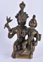 A 19TH CENTURY INDIAN BRONZE FIGURE OF A HINDU DEITY modelled with an attendant. 17 cm x 10 cm.