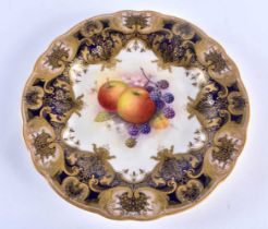Royal Worcester plate with a raised blue and gilt border, the centre painted with fruit by Albert