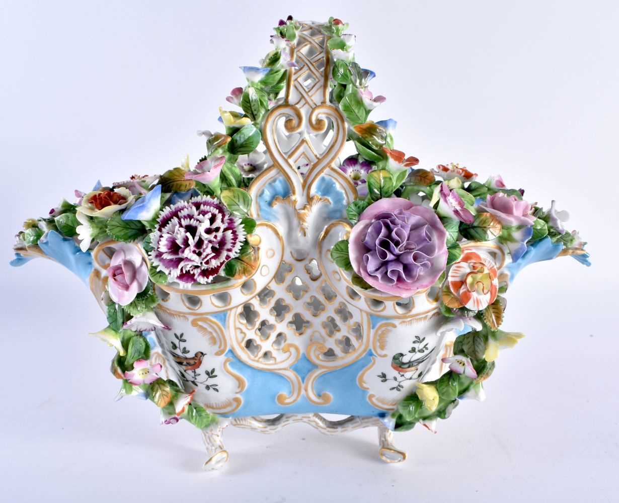 Mid 19th century beautiful English porcelain basket the pierced sides and over handle painted in