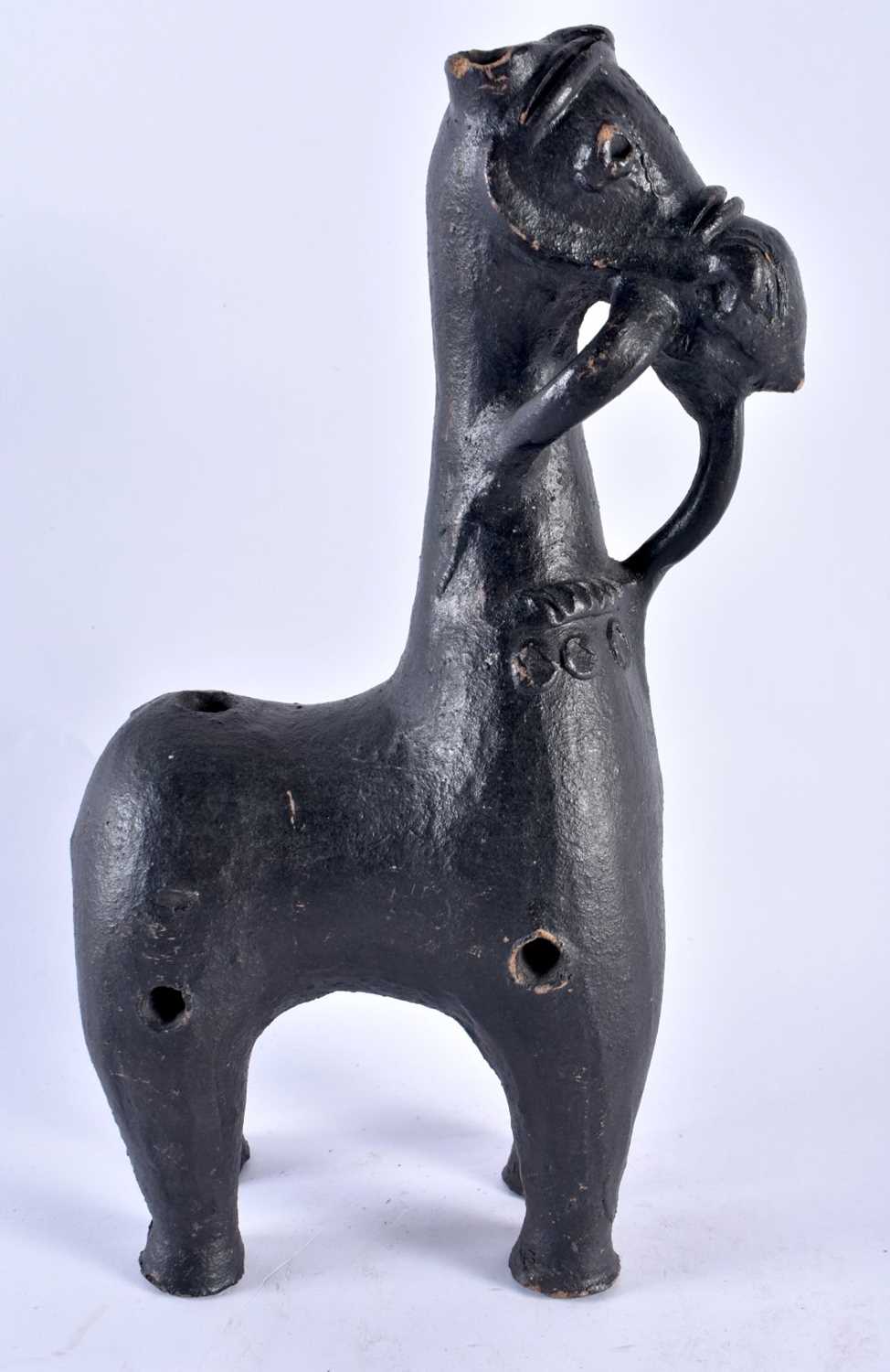 A LARGE 18TH/19TH CENTURY SOUTHERN EUROPEAN POTTERY FIGURE OF A HORSE of zoomorphic form, after