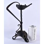 A LOVELY ARTS AND CRAFTS WROUGHT IRON BETTY LAMP of organic form. 30 cm x 17 cm.