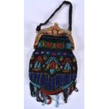AN ART DECO BEADWORK PURSE the mounts decorated with a mythical dolphins. 38 cm x 15 cm.
