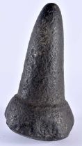 AN UNUSUAL EARLY HAWIAN CARVED VOLCANIC STONE POUNDER of almost rhinoceros horn form. 21 cm high.