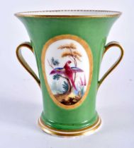 Sevres two handled vase with green ground, the gilt tooled oval panel painted with birds in the