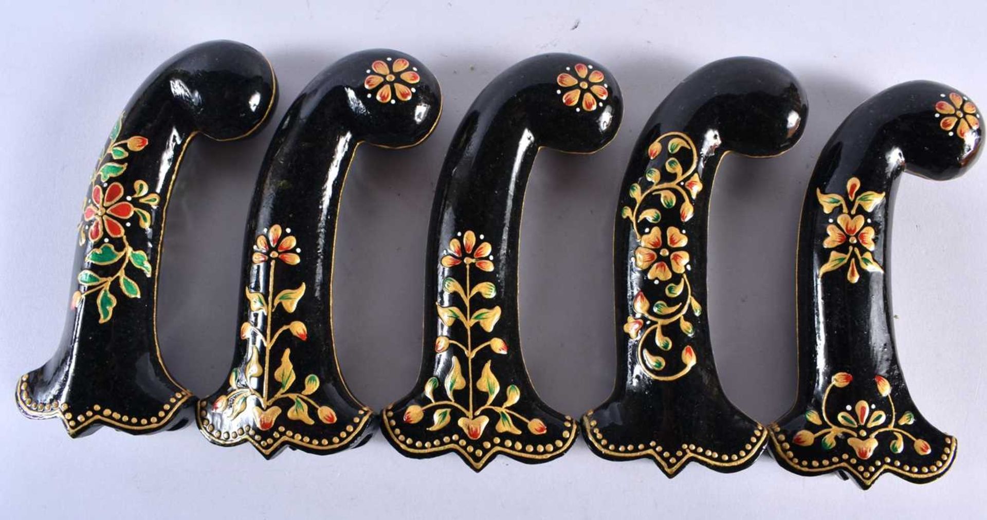 A SET OF FIVE MIDDLE EASTERN QAJAR LACQUER HARDSTONE DAGGER HANDLES overlaid with foliage and vines. - Image 5 of 6